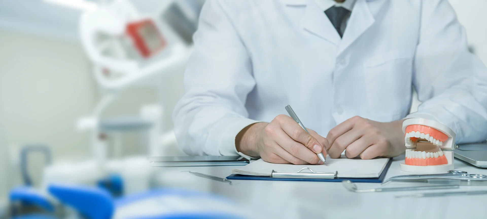A dentist reviewing a treatment plan at Anamosa Dental Associates