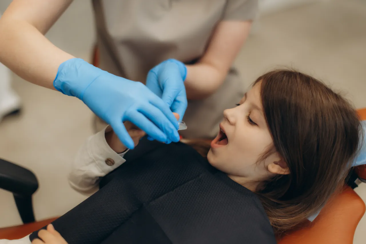 A young patient having fluoride applied at the dentist