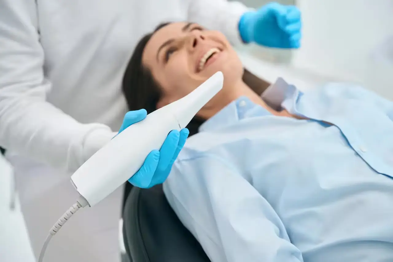 A clinician using an intraoral camera during an exam