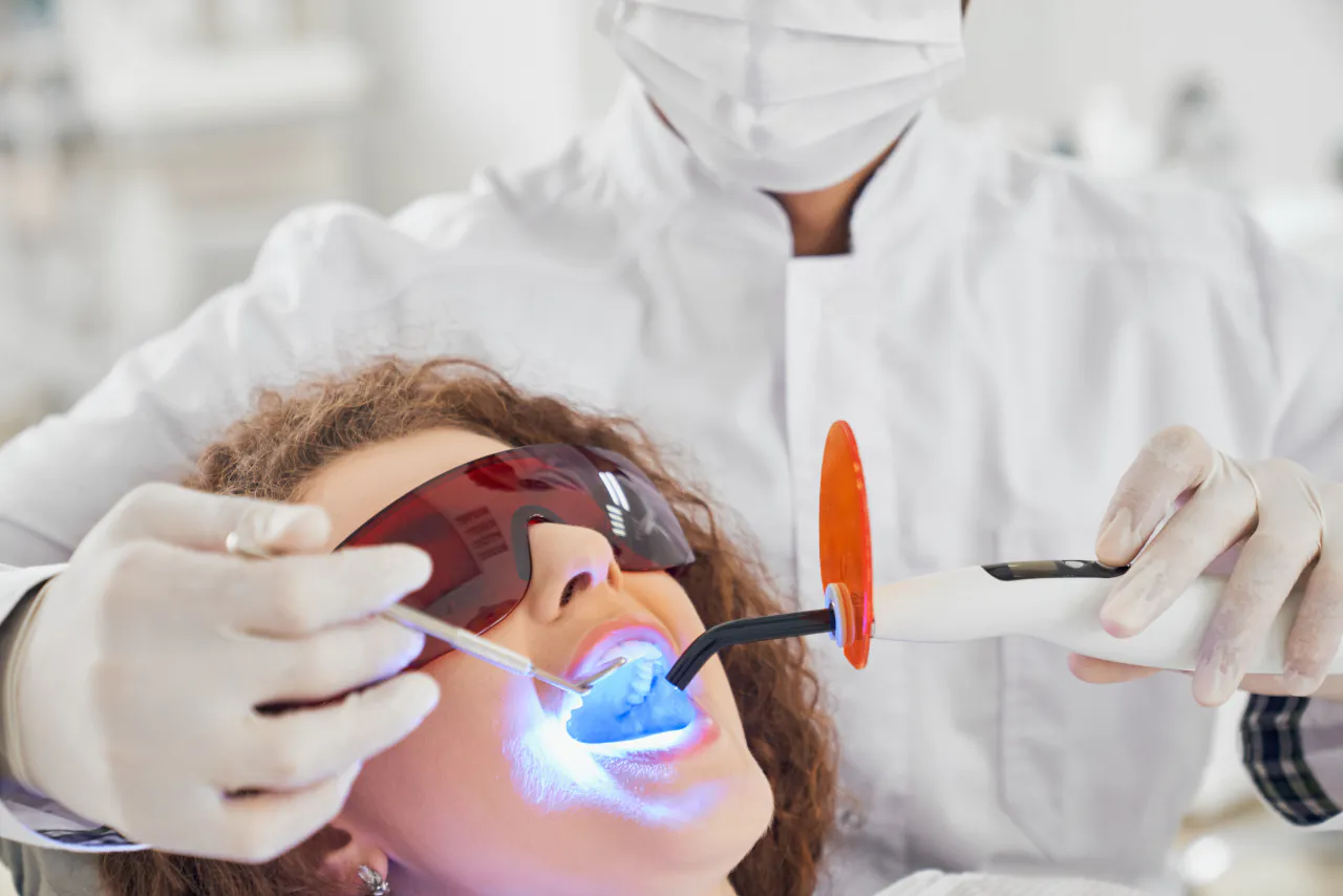 A patient in protective eyewear during a laser treatment
