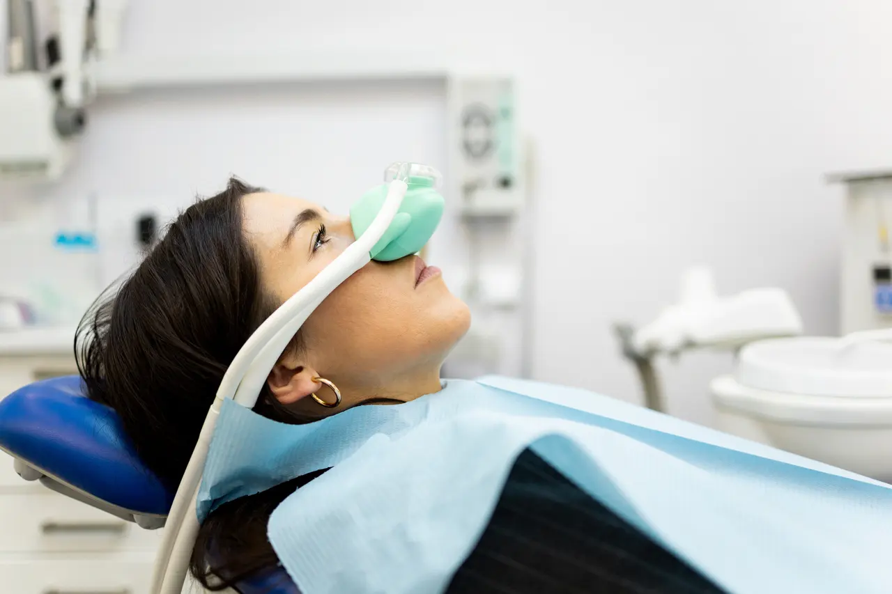 A patient relaxing with a nitrous oxide mask