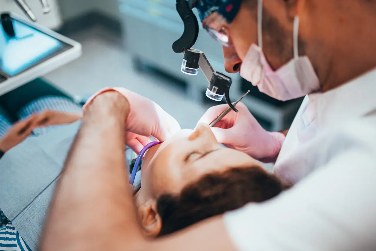 A dental team carrying out root canal treatment