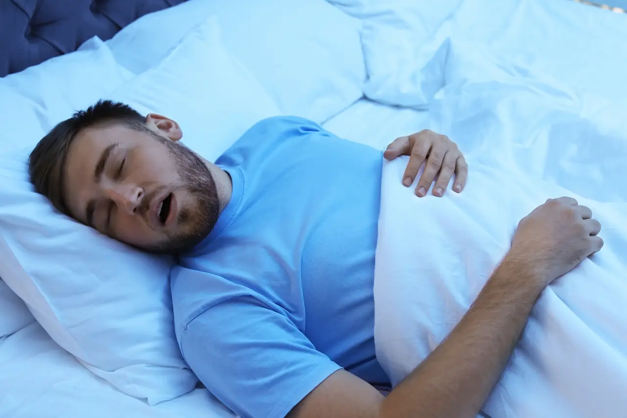 A man snoring while asleep